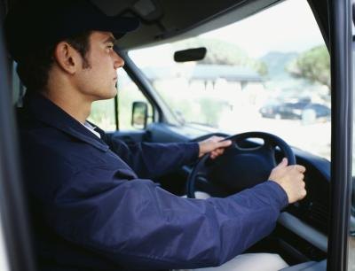 Truck driver in his tractor-trailer truck Truck driver in his tractor-trailer truck