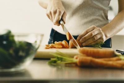 Woman chopping vegetables Woman chopping vegetables