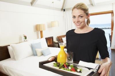 Hotel employee delivering room service Hotel employee delivering room service