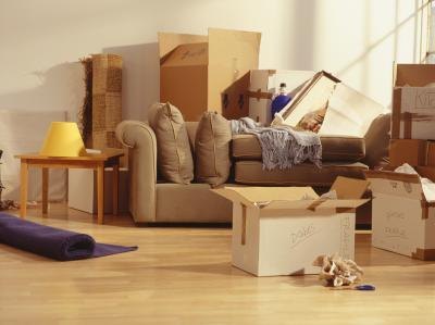Unpacked moving boxes in a living room Unpacked moving boxes in a living room