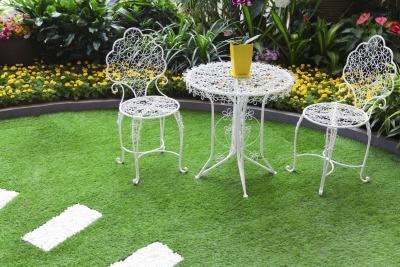 Surround a small table and chairs with carefully selected plantings to create an inviting outdoor retreat. Surround a small table and chairs with carefully selected plantings to create an inviting outdoor retreat.