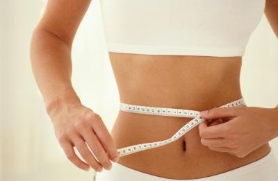 woman measuring stomach woman measuring stomach