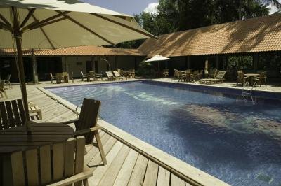 Swimming pool surrounded by roof deck Swimming pool surrounded by roof deck