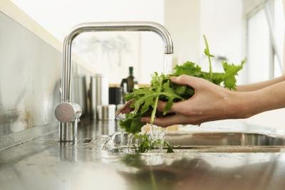 Washing green leafy vegetables. Washing green leafy vegetables.