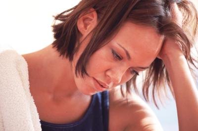 tired woman with low levels of Estradiol tired woman with low levels of Estradiol