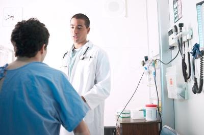 A doctor and patient discuss the procedure. A doctor and patient discuss the procedure.