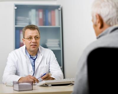 A man talks with his doctor about testosterone levels. A man talks with his doctor about testosterone levels.