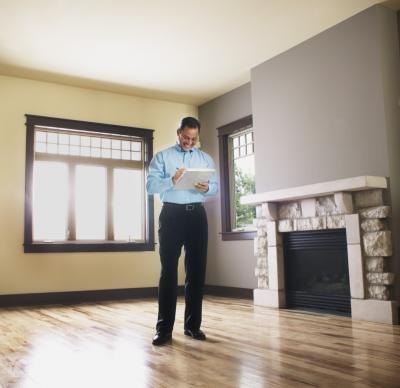 Man with checklist in empty home Man with checklist in empty home