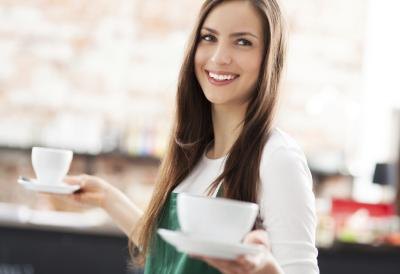 hipster woman carrying two cups of coffee hipster woman carrying two cups of coffee