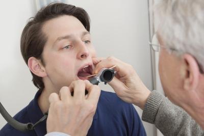 Doctor looking in mouth Doctor looking in mouth