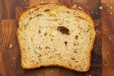 A slice of whole grain bread. A slice of whole grain bread.