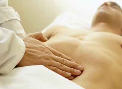 doctor pressing on stomach doctor pressing on stomach