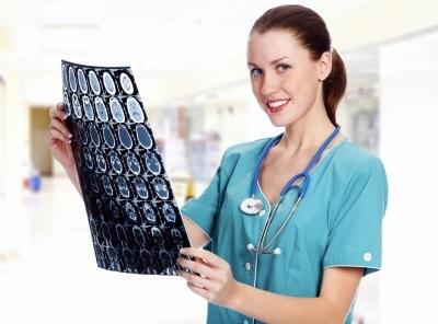 Nurse looking at a scan. Nurse looking at a scan.