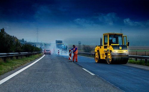 Several different types of construction vehicles are used in constructing new highways. Several different types of construction vehicles are used in constructing new highways.