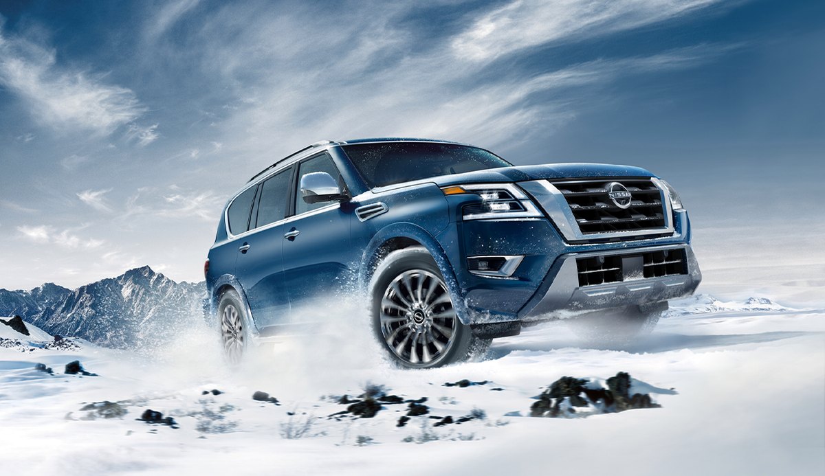 nissan vehicle driving through snow