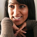 A young woman smiles at the camera.