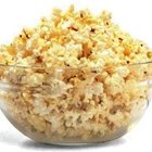 Popcorn in a bowl on wooden table