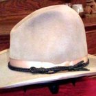 Portrait of a young man wearing a cowboy hat