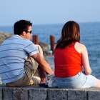 Smiling young couple walking in dry riverbed