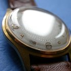 Man checking time on wrist watch, close-up