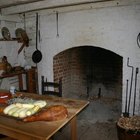 Cook baker prepares bread, focaccia, pizza, buns, sweets. Horizontal photo. Bakery concept, cooking flour products. Design for text.