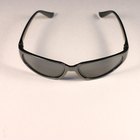 Spanish archaeological site reflected in woman's sunglasses