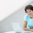 Woman with laptop on couch