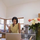 Woman helping man with computer