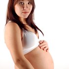 Couple with pregnancy test smiling