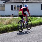 Male cyclist leaning on mountain bike