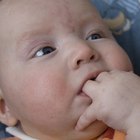 Newborn baby in mother's arms