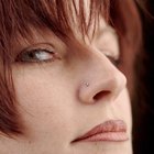 Woman trying on earrings in store