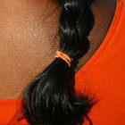 Woman using mousse in hair