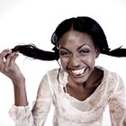 Smiling woman combing her hair