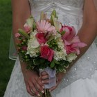Bride holding bouquet beside groom