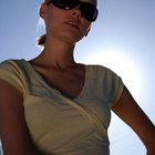 Close-up mid section of a woman standing at beach