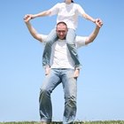 Man giving woman piggyback ride in field