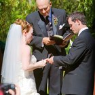 Bride and groom holding hands at wedding