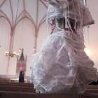 portrait of a bride a two bridesmaid outside a church