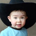 Portrait of a young man wearing a cowboy hat