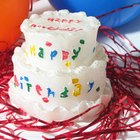 Girl (9-11) at birthday party, leaning over birthday cake, portrait