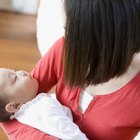 Newborn baby sleeping on the bed