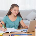 Young girl with headset doing homework on floor