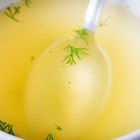 White ceramic dish of apple sauce on white.