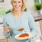 pasta with cheese and tomato on wood