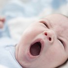 portrait of a baby boy in a crib