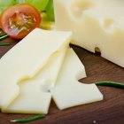 Sliced Cheese on wooden background