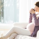 pregnant woman cooking at kitchen