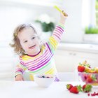 Baby eating rice cakes