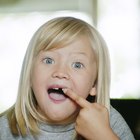 A baby with fingers in mouth